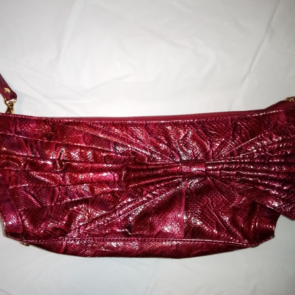 Cate Adair dark red croc with bow on front and iridescent purple interior